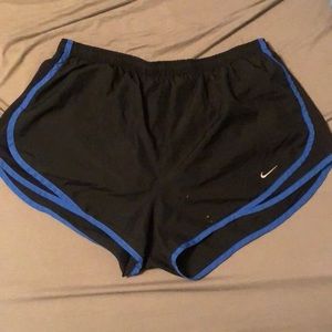 Black Nike shorts with blue trim. XL.